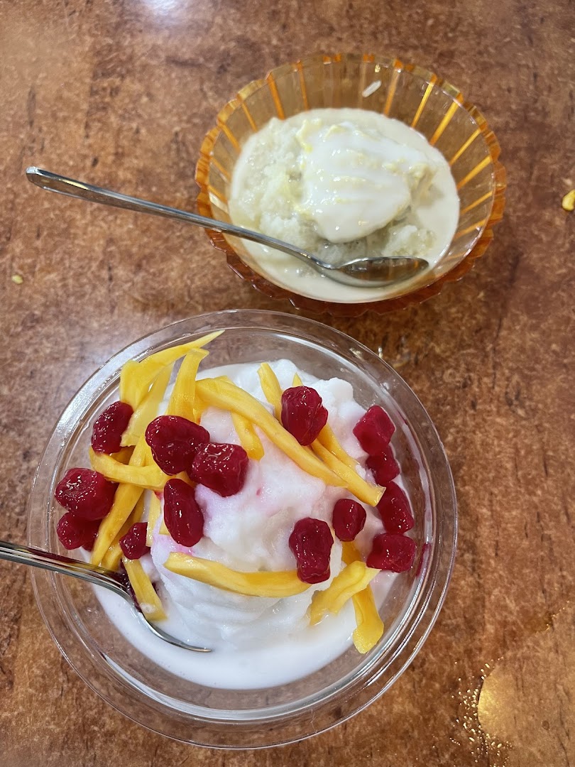 Two bowls of traditional Thai desserts, one with red rubies and jackfruit, the other with durian.