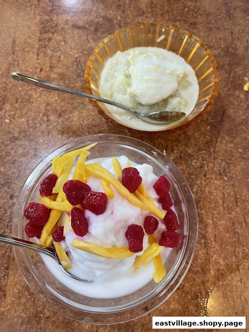 Two bowls of traditional Thai desserts, one with red rubies and jackfruit, the other with durian.
