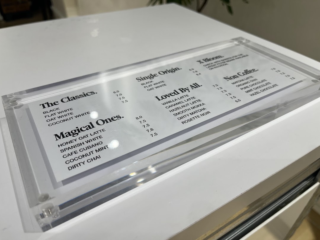 A clear, minimalist menu for Ground Floor Coffee, showcasing a variety of coffee and non-coffee beverages.