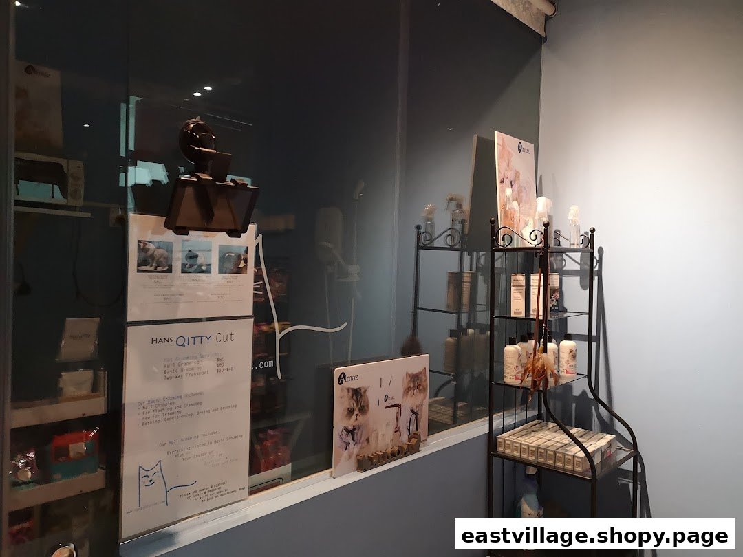 Interior view of Hans Qitty Cut, showcasing pet grooming services price list and product display.
