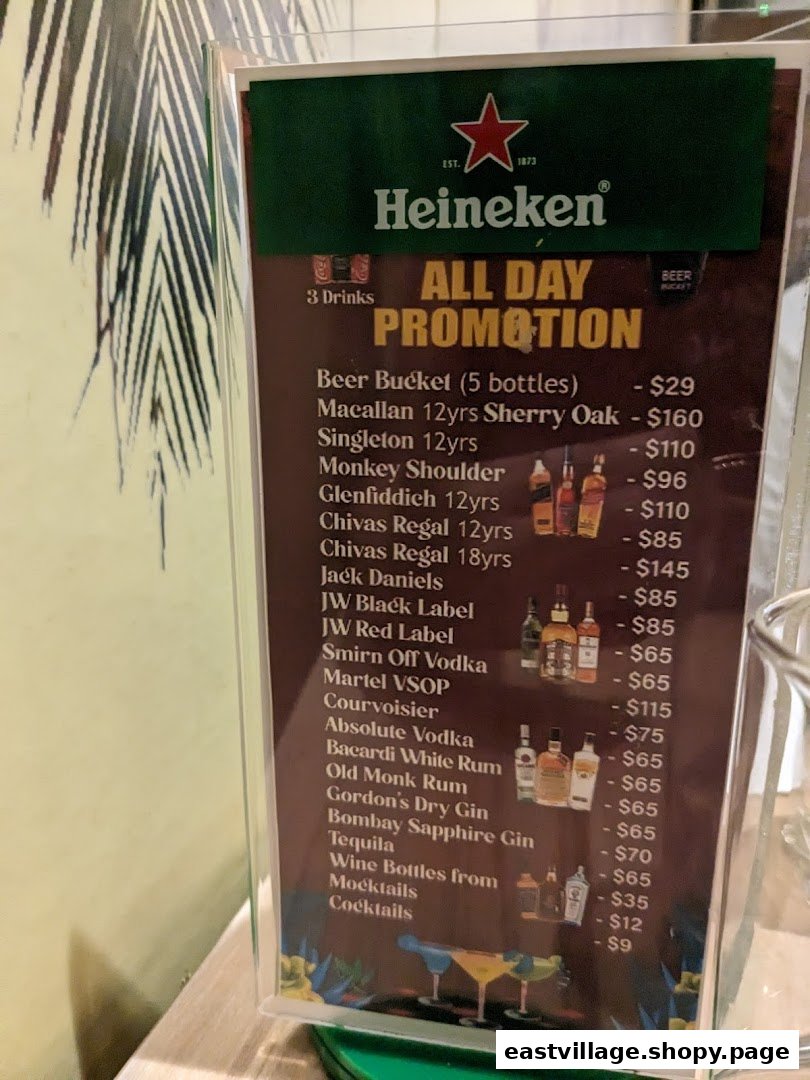 A menu display board showcasing an 'All Day Promotion' for various alcoholic and non-alcoholic beverages.