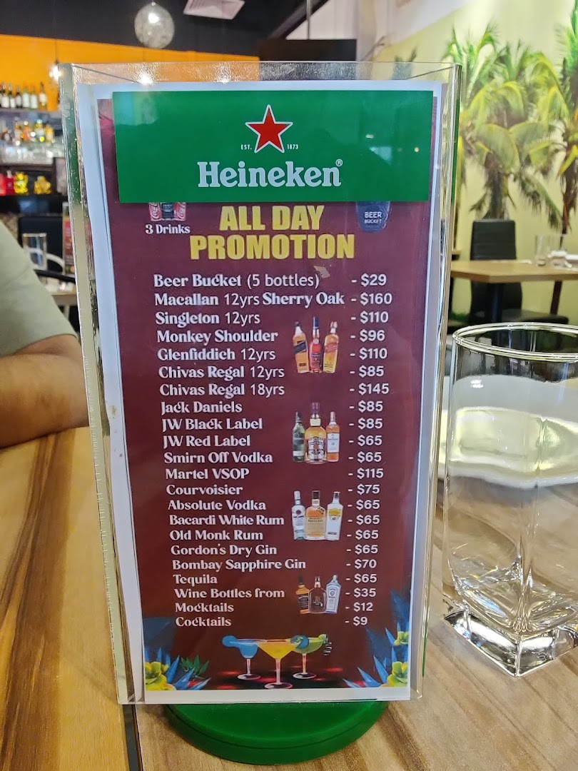 A table-top display showcasing an 'All Day Promotion' menu for various alcoholic beverages and cocktails.