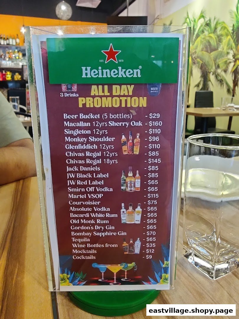A table-top display showcasing an 'All Day Promotion' menu for various alcoholic beverages and cocktails.
