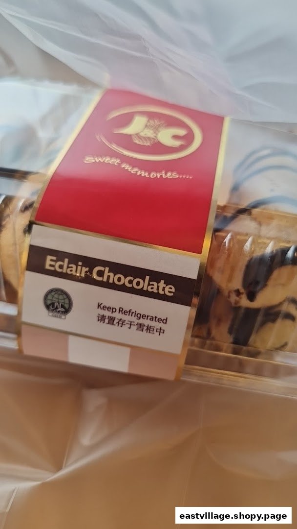 A box of J C Bakery's Eclair Chocolate pastries in a clear plastic bag.