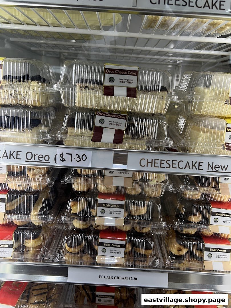 Various packaged desserts, including Oreo Cheesecake and Eclair Cream, displayed in a refrigerated case.