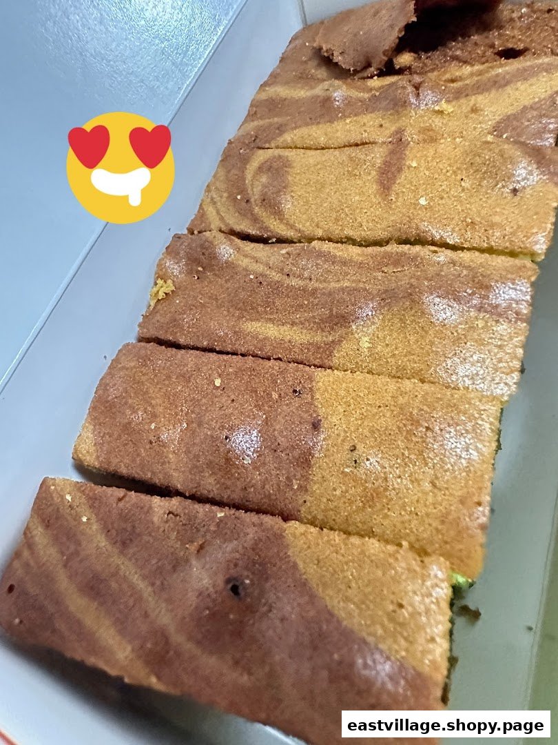 Close-up of delicious marble cake slices with a swirled pattern in a white box.