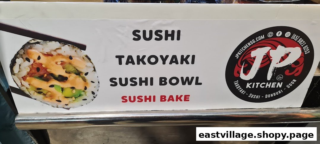 A sign for JP Kitchen displaying popular Japanese food items like sushi, takoyaki, sushi bowls, and sushi bake.