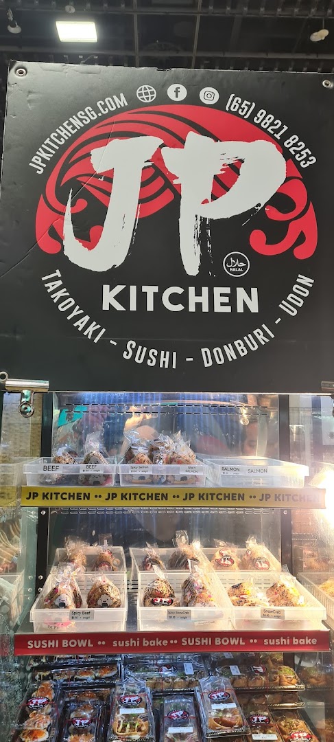 A shop front for JP KITCHEN, featuring its logo, contact info, and a display of Japanese grab-and-go food.