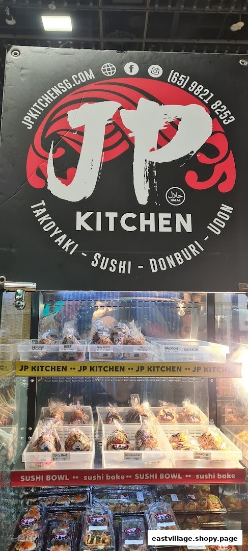 A shop front for JP KITCHEN, featuring its logo, contact info, and a display of Japanese grab-and-go food.