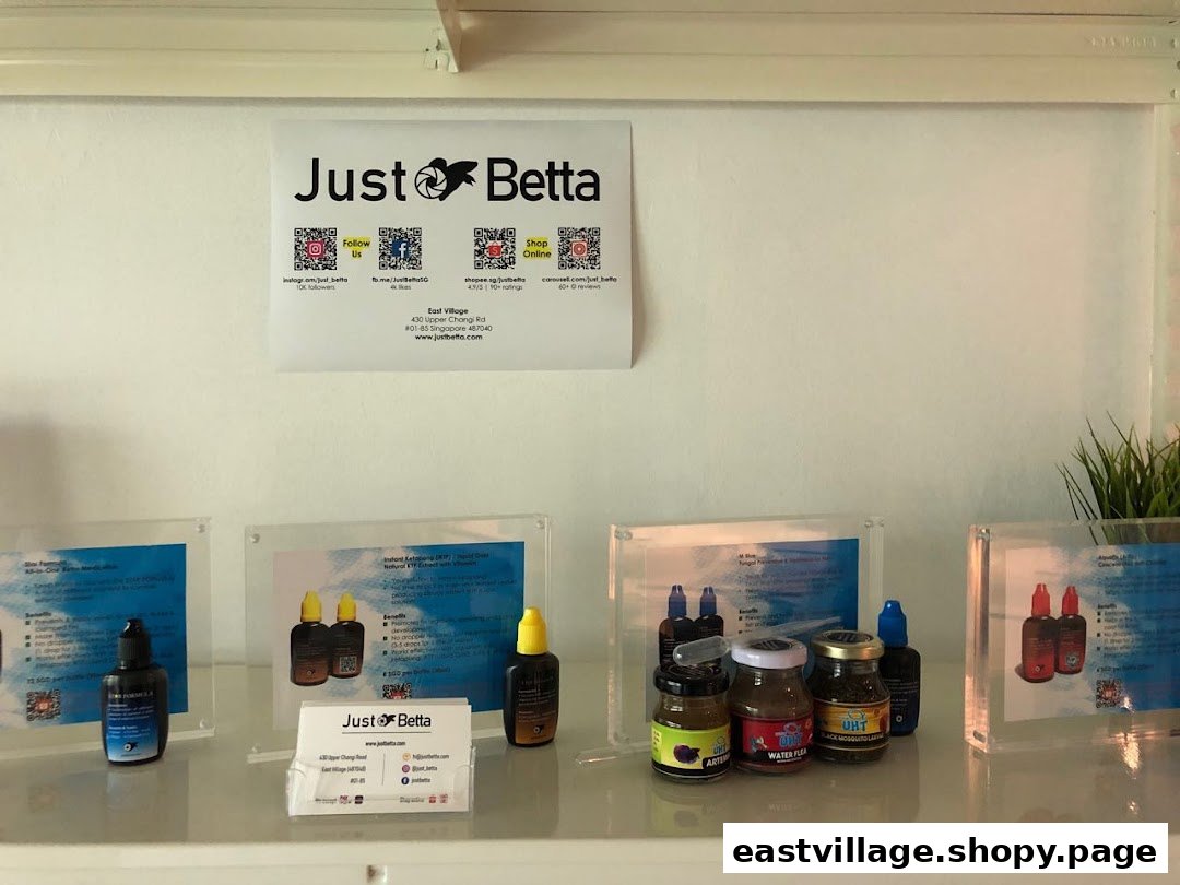 An interior display at Just Betta, showcasing fish care products and branding.