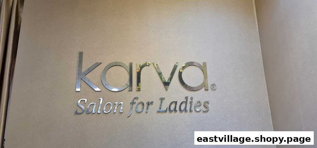 The image displays the elegant 'KARVA Salon for Ladies' signage on a textured wall.