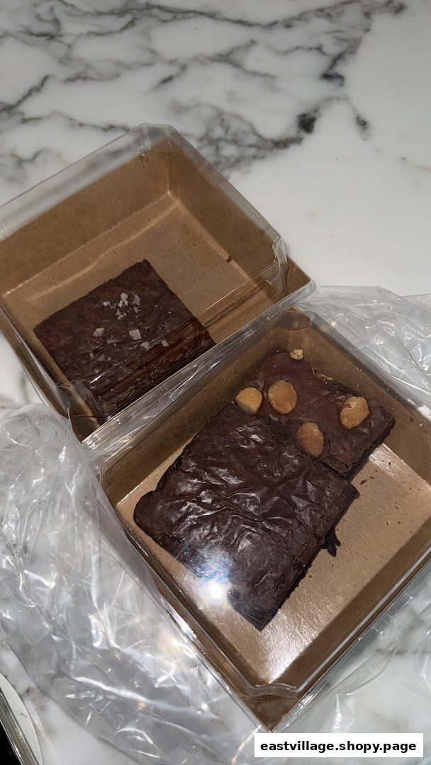 Two boxes of delicious brownies, one with sea salt and one with macadamia nuts.