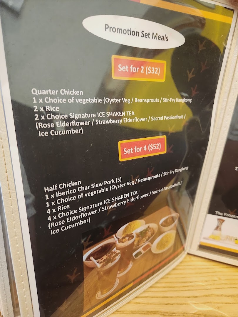 A close-up of a menu displaying promotion set meals for chicken rice and other dishes.