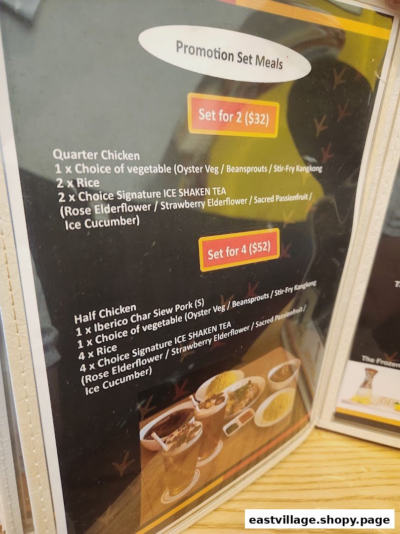 A close-up of a menu displaying promotion set meals for chicken rice and other dishes.
