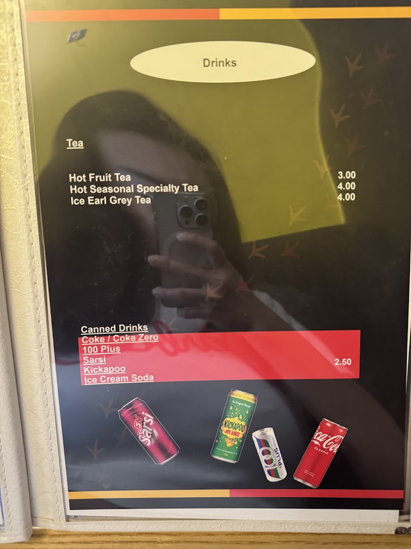 A drinks menu featuring various teas and canned beverages with prices.