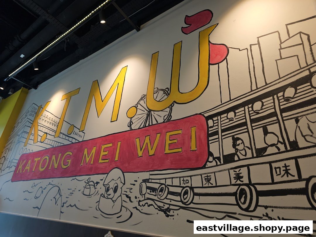 A vibrant wall mural featuring the shop's name 'KTMW KATONG MEI WEI' and a cityscape.