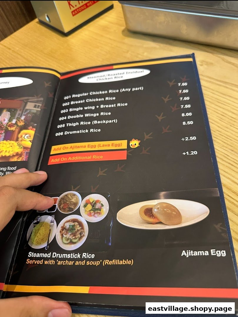 A close-up of a menu page displaying various chicken rice options and add-ons with prices.