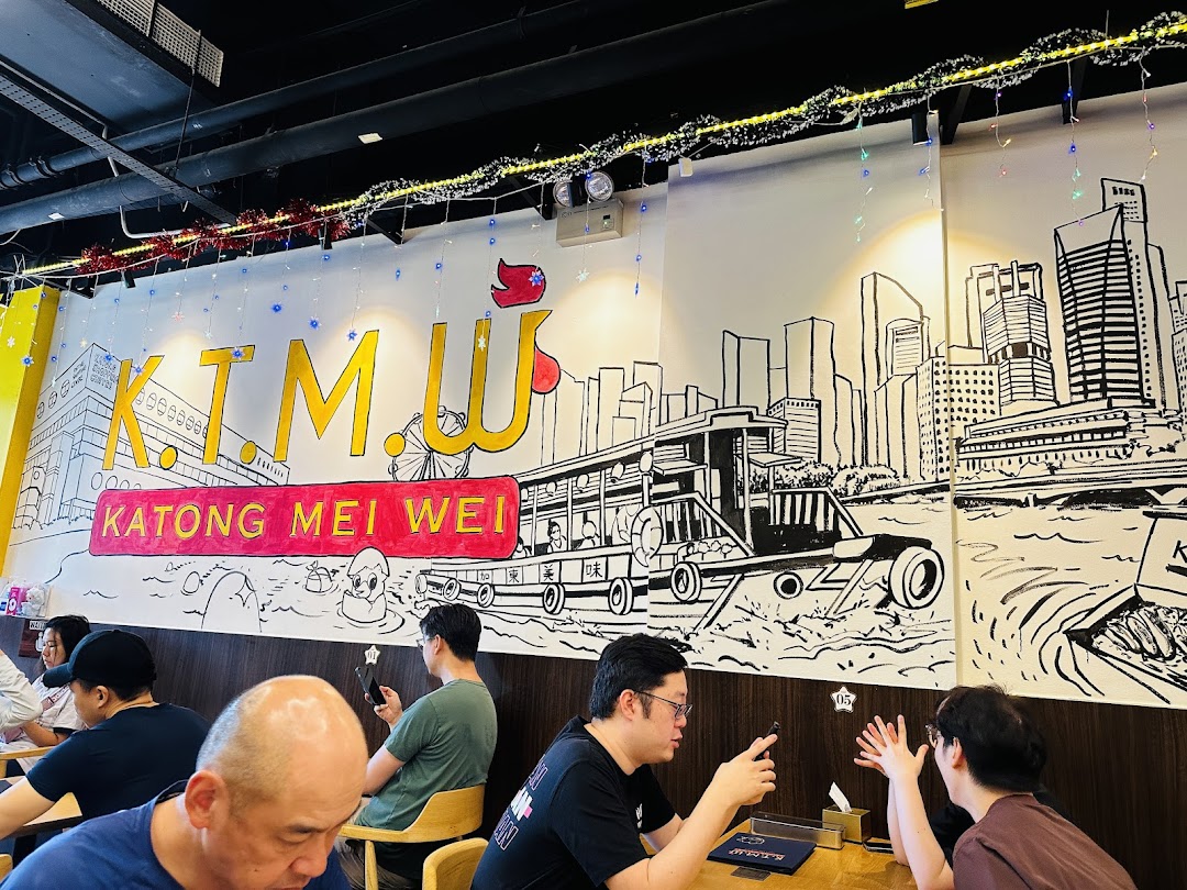 Customers enjoy the vibrant interior of KTMW Katong Mei Wei, featuring a large, illustrative wall mural.