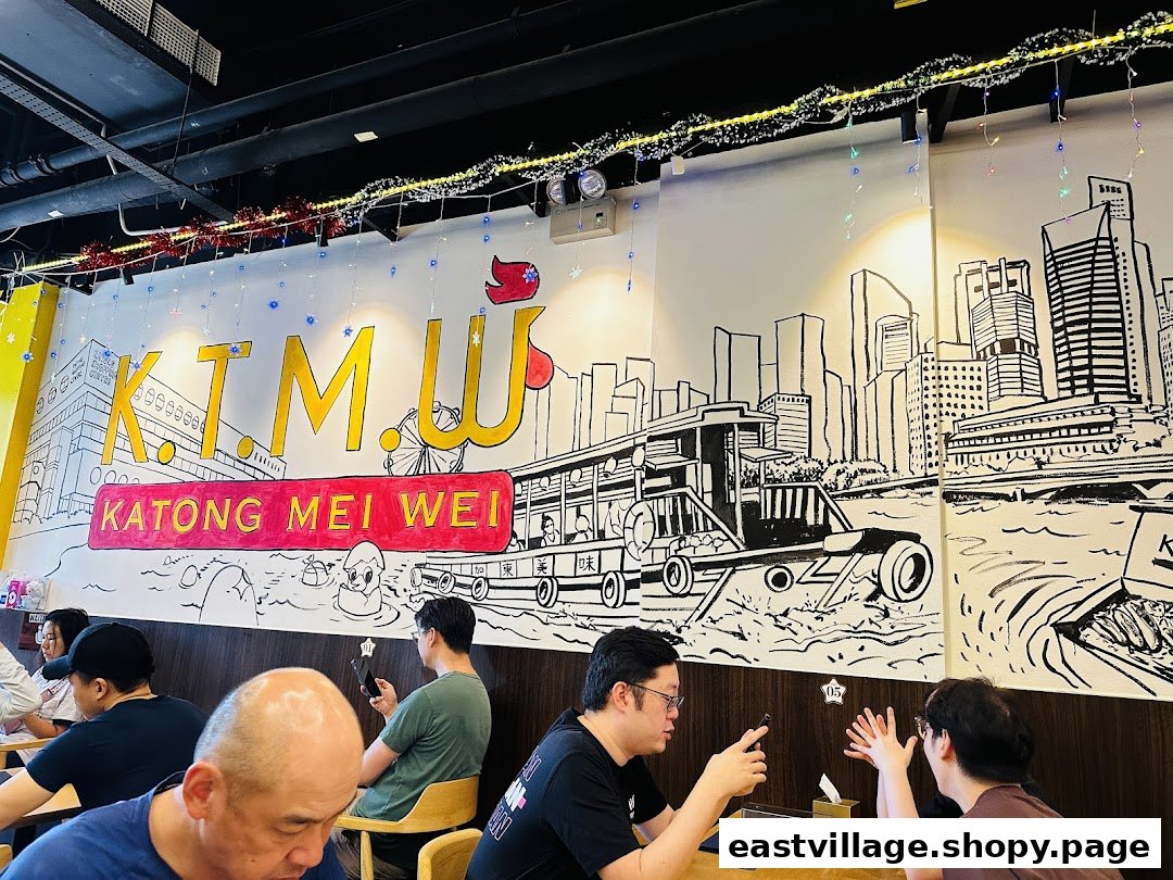 Customers enjoy the vibrant interior of KTMW Katong Mei Wei, featuring a large, illustrative wall mural.