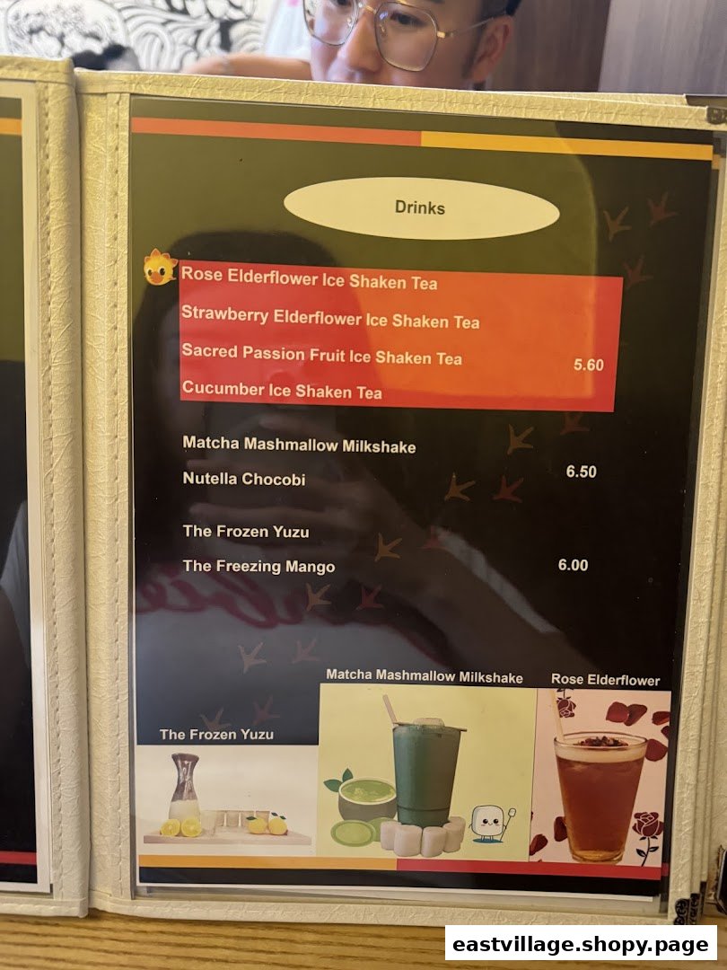 A close-up of a drinks menu from KTMW KATONG MEI WEI, featuring teas, milkshakes, and frozen beverages.