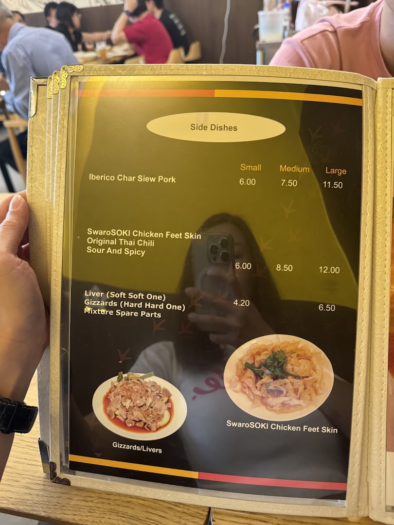 A close-up view of a menu displaying side dishes and their prices at KTMW Katong Mei Wei.
