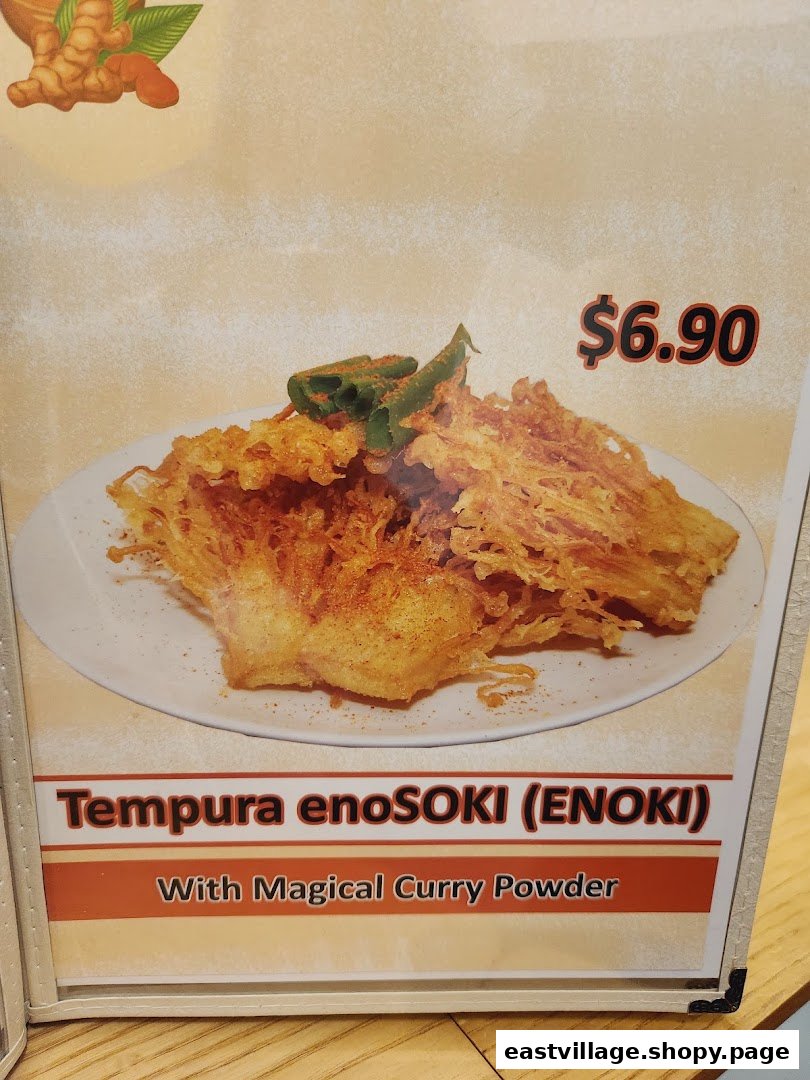 A menu display featuring crispy Tempura enoSoki (Enoki) with magical curry powder, priced at $6.90.