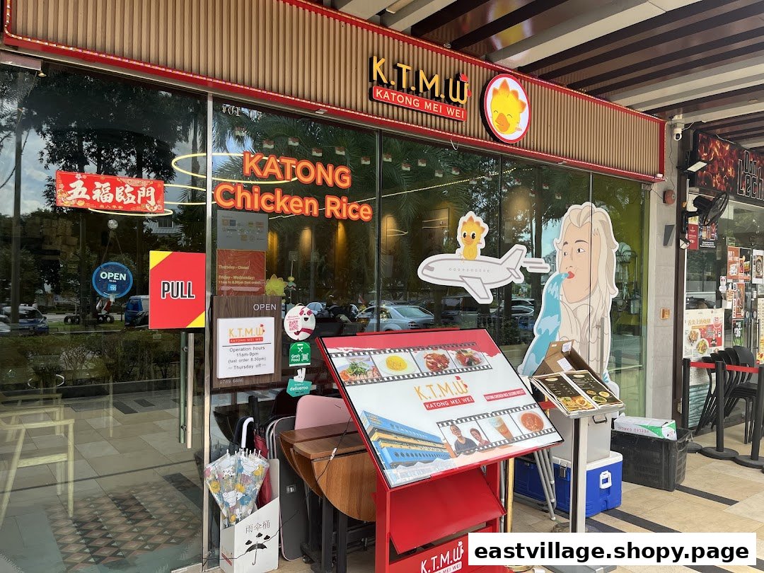 The vibrant exterior of KTMW Katong Mei Wei chicken rice tea-cafe, showcasing its entrance and signage.