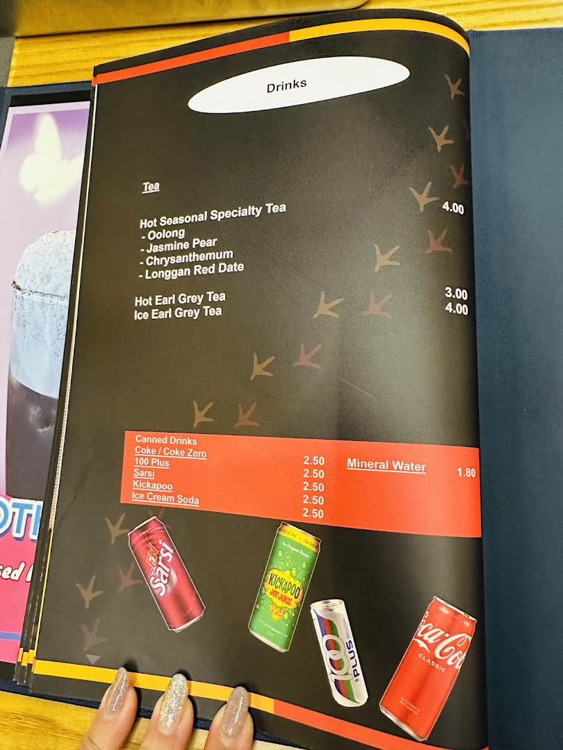 A menu page displaying various tea and canned drink options with their prices.