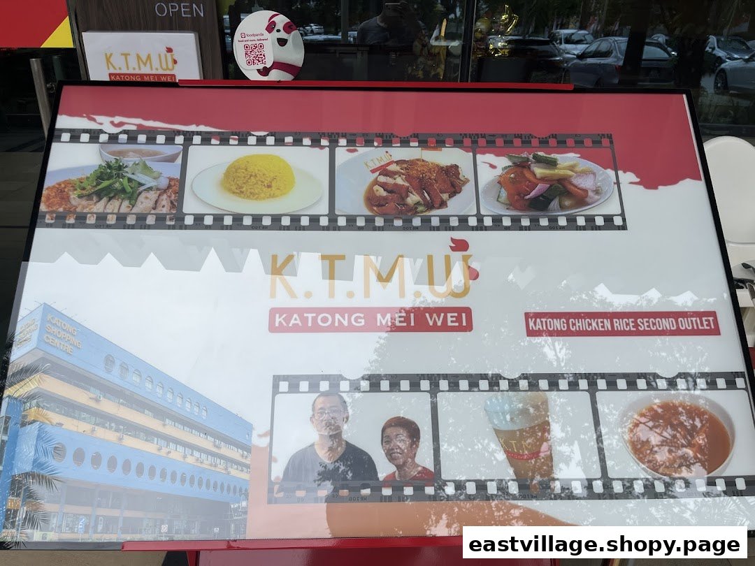 A large outdoor display board for KTMW Katong Mei Wei, showcasing chicken rice dishes and branding.