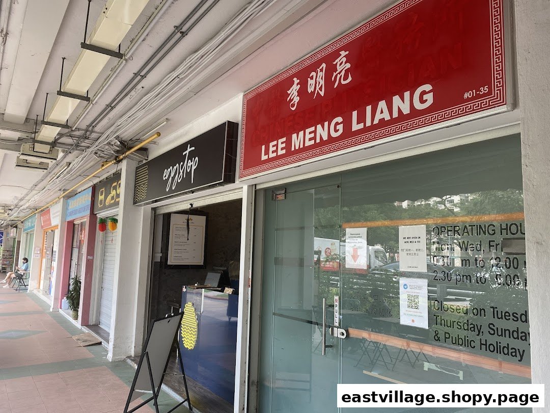 The shopfront of Lee Meng Liang Therapy, featuring its red signboard and glass entrance.