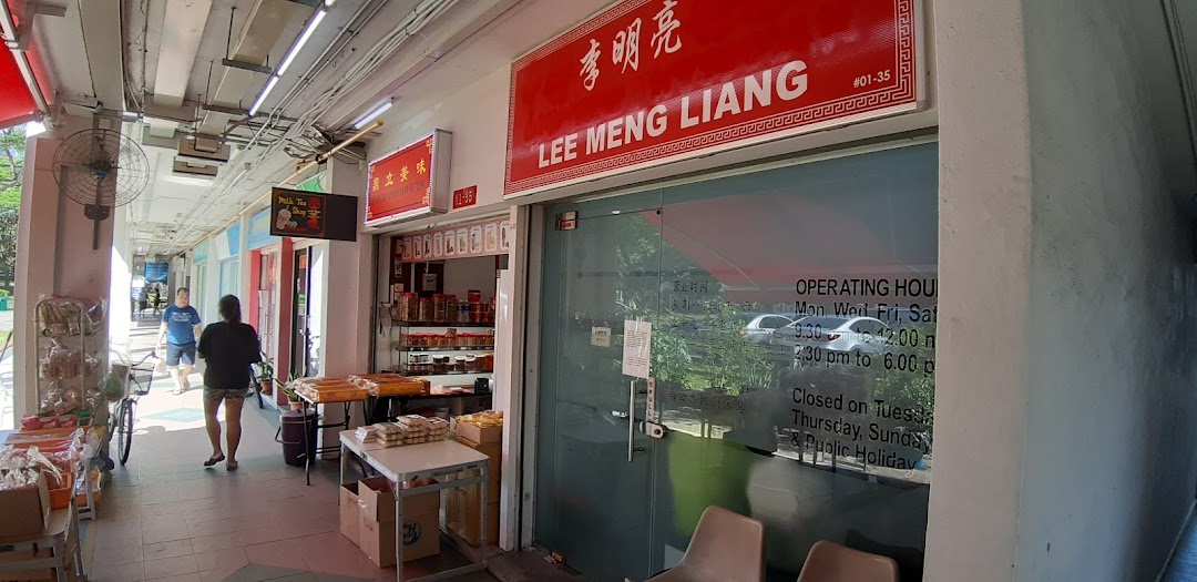 The exterior of Lee Meng Liang shop with its red signage, glass entrance, and operating hours displayed.