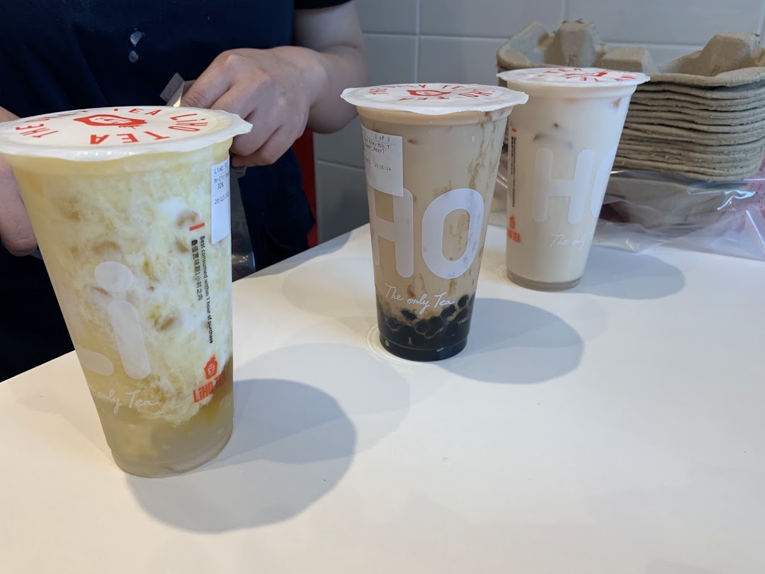 Three refreshing LiHO TEA bubble tea drinks are displayed on a clean counter.