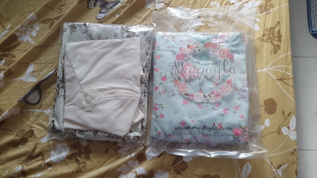 Two packaged clothing items from Maqayla, featuring floral and plain designs.