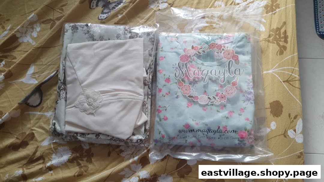 Two packaged clothing items from Maqayla, featuring floral and plain designs.