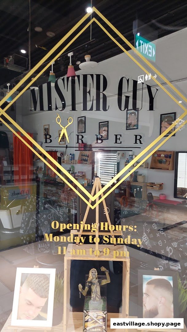 The storefront of Mister Guy Barber, featuring its logo, interior view, and operating hours.