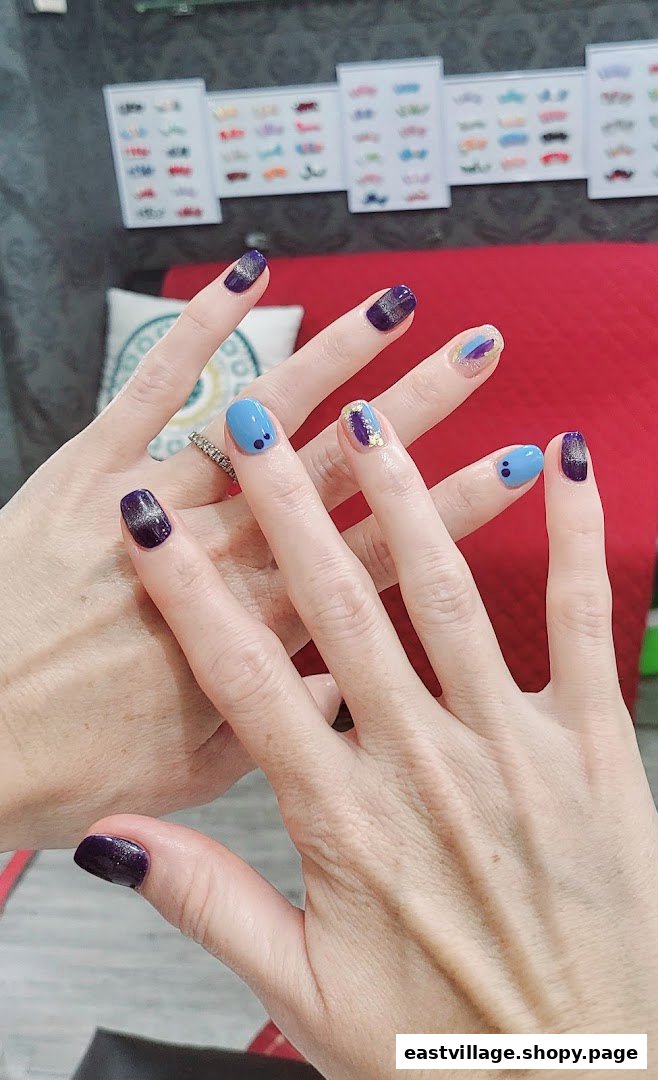 Close-up of two hands showcasing various vibrant and stylish manicured nail designs.