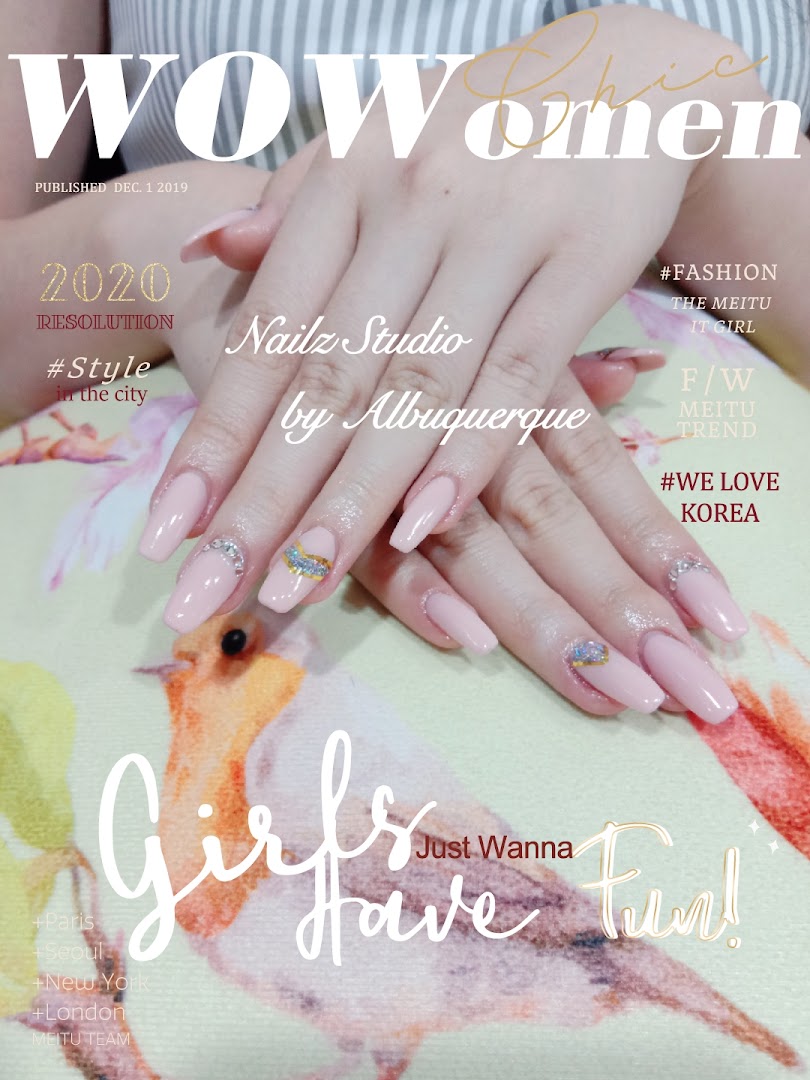 Close-up of hands with elegant pink manicured nails featuring decorative accents, presented like a magazine cover.