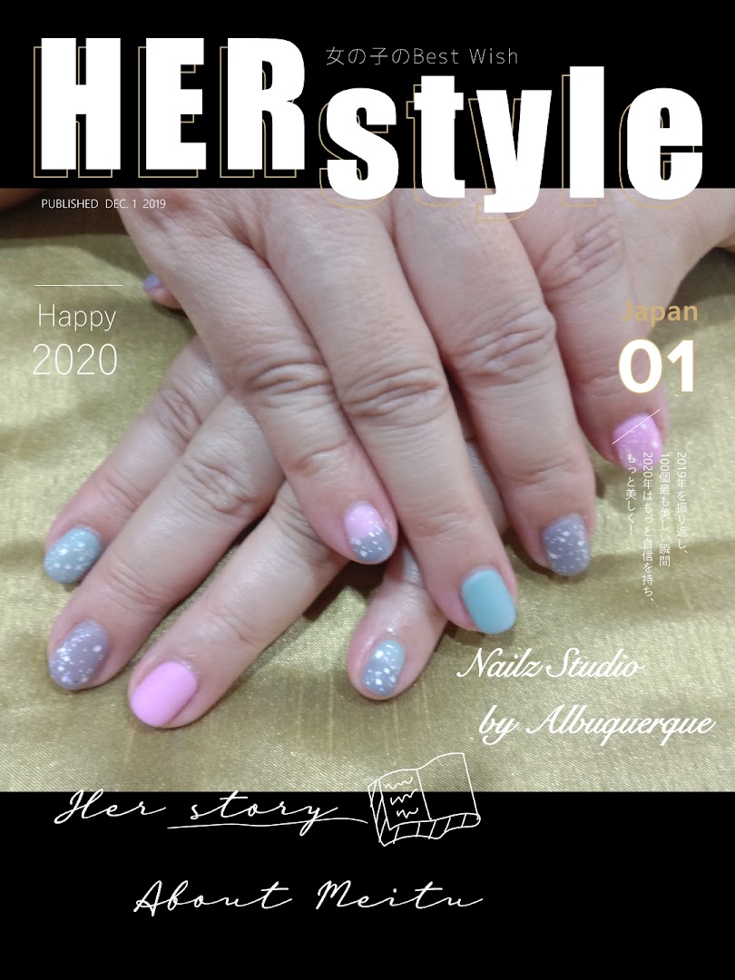 Close-up of hands showcasing a vibrant, glittery nail art design by Nailz Studio.