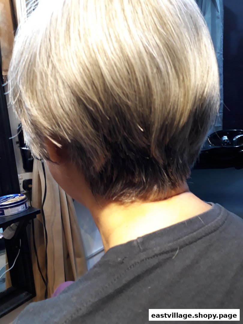 Close-up of a client's freshly styled short hair from behind at Niki Beauty Wellness Salon.