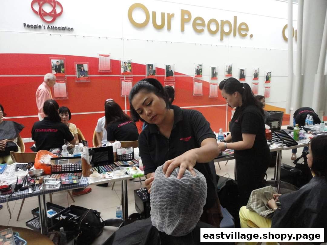Salon staff provide beauty services to clients in an active, well-equipped setting.