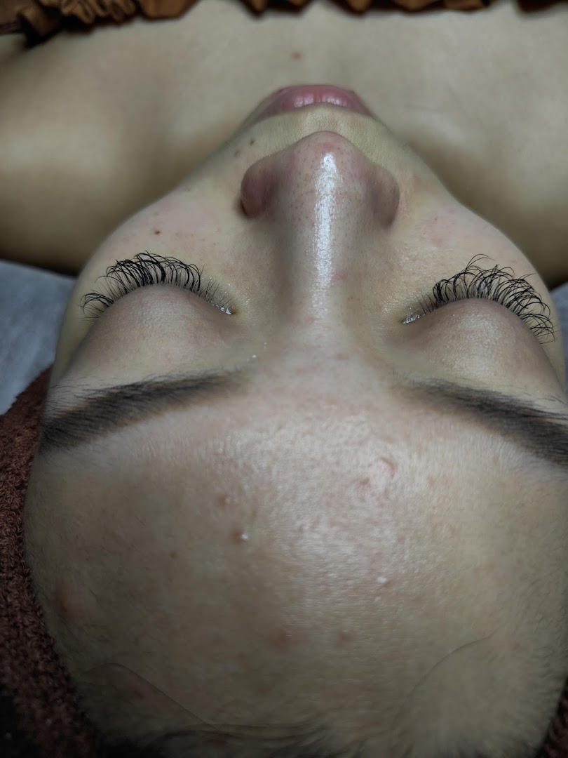Close-up of a client's face showcasing newly applied eyelash extensions.