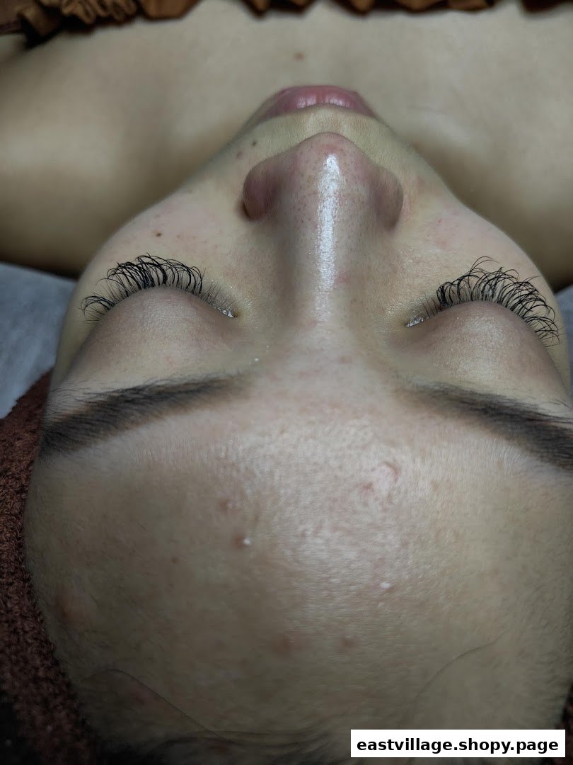 Close-up of a client's face showcasing newly applied eyelash extensions.