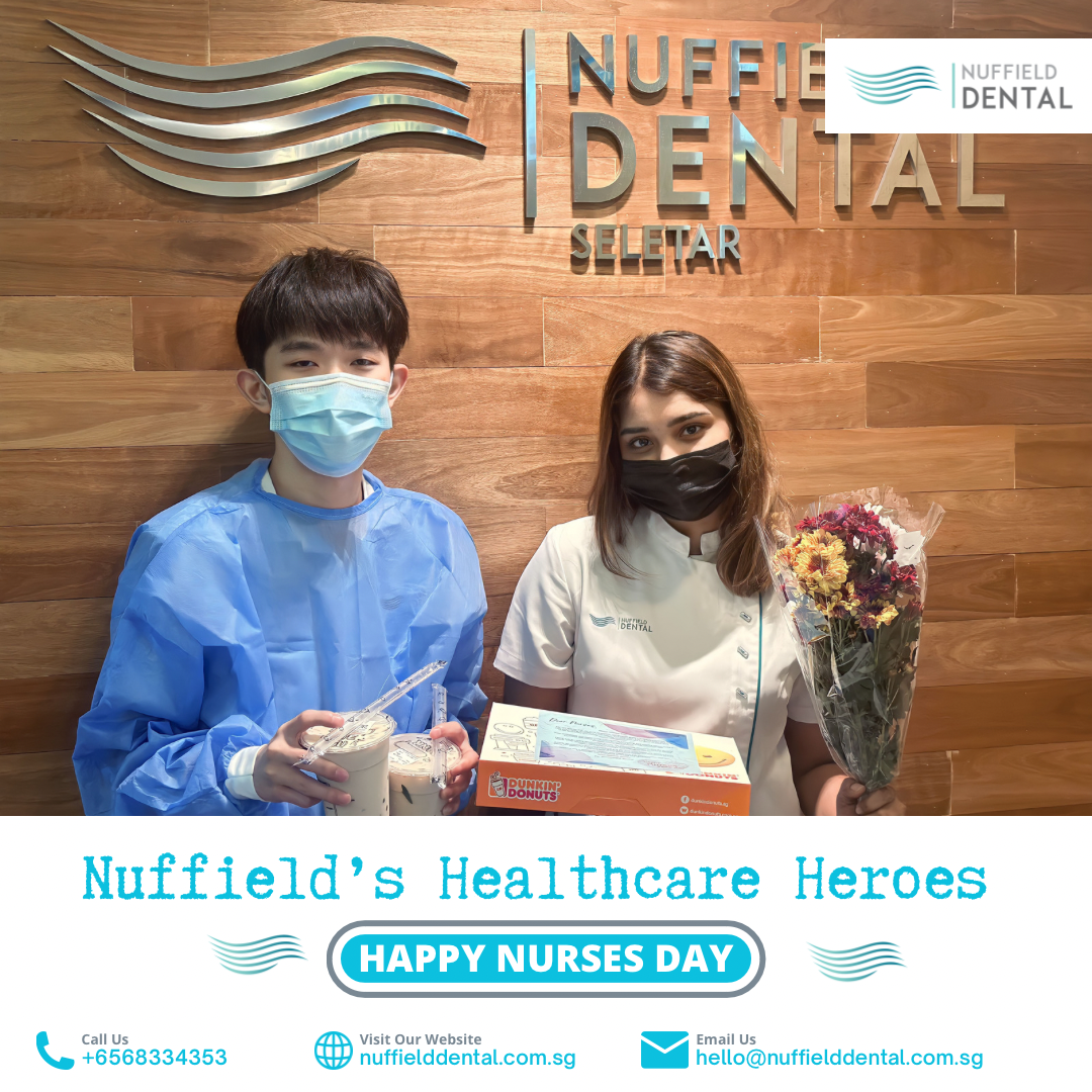 Two individuals, one patient and one staff, holding gifts in Nuffield Dental clinic, celebrating Nurses Day.