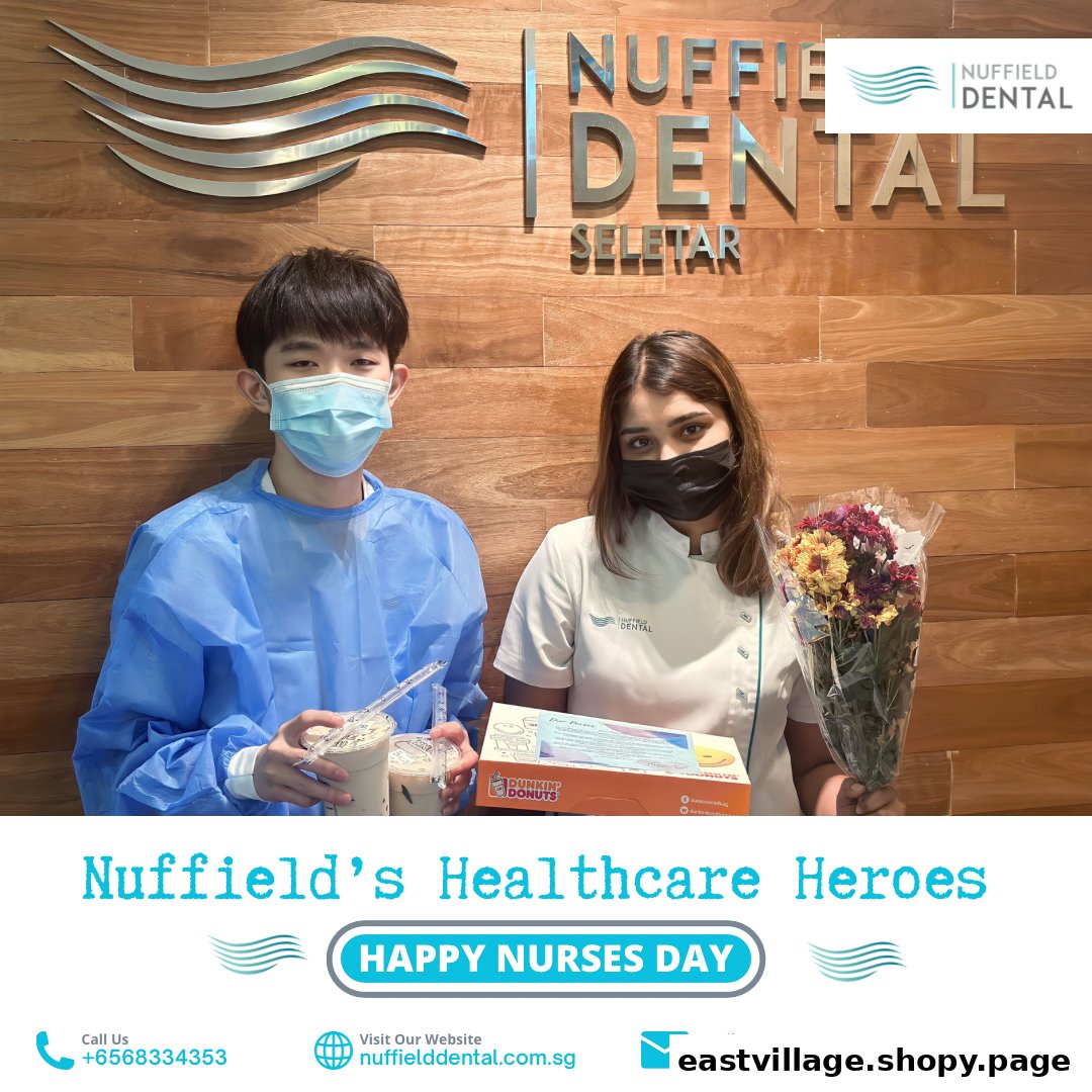 Two individuals, one patient and one staff, holding gifts in Nuffield Dental clinic, celebrating Nurses Day.