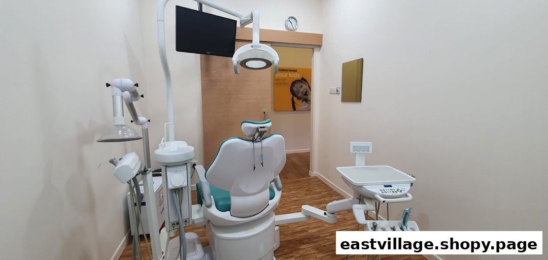 A modern dental treatment room featuring a patient chair and professional dental equipment.
