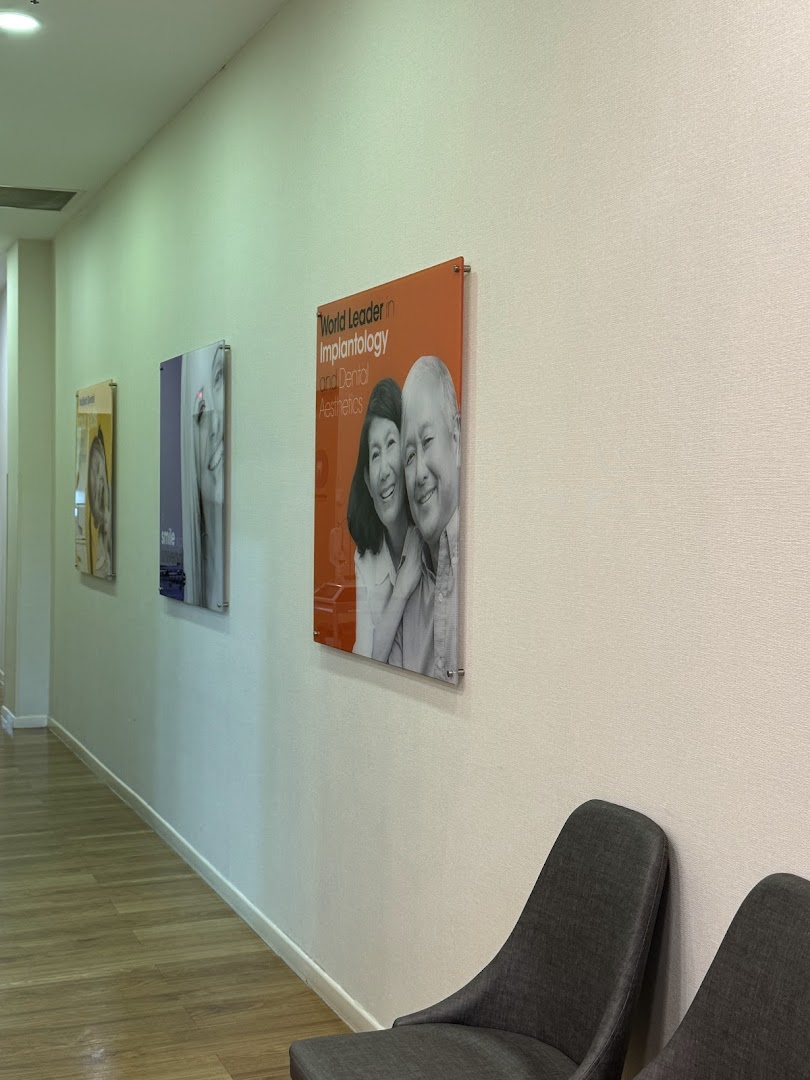 Interior view of Nuffield Dental's waiting area with marketing posters and comfortable seating.