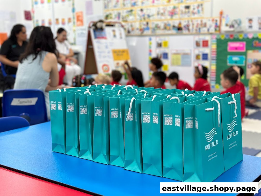 Nuffield Dental gift bags on a table during a community or educational event.