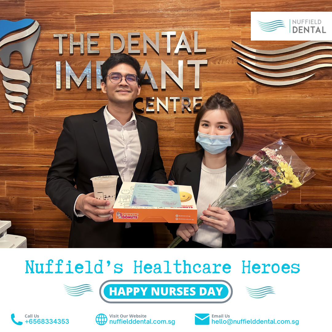 Two Nuffield Dental staff members celebrating Nurses Day with gifts and flowers inside the clinic.