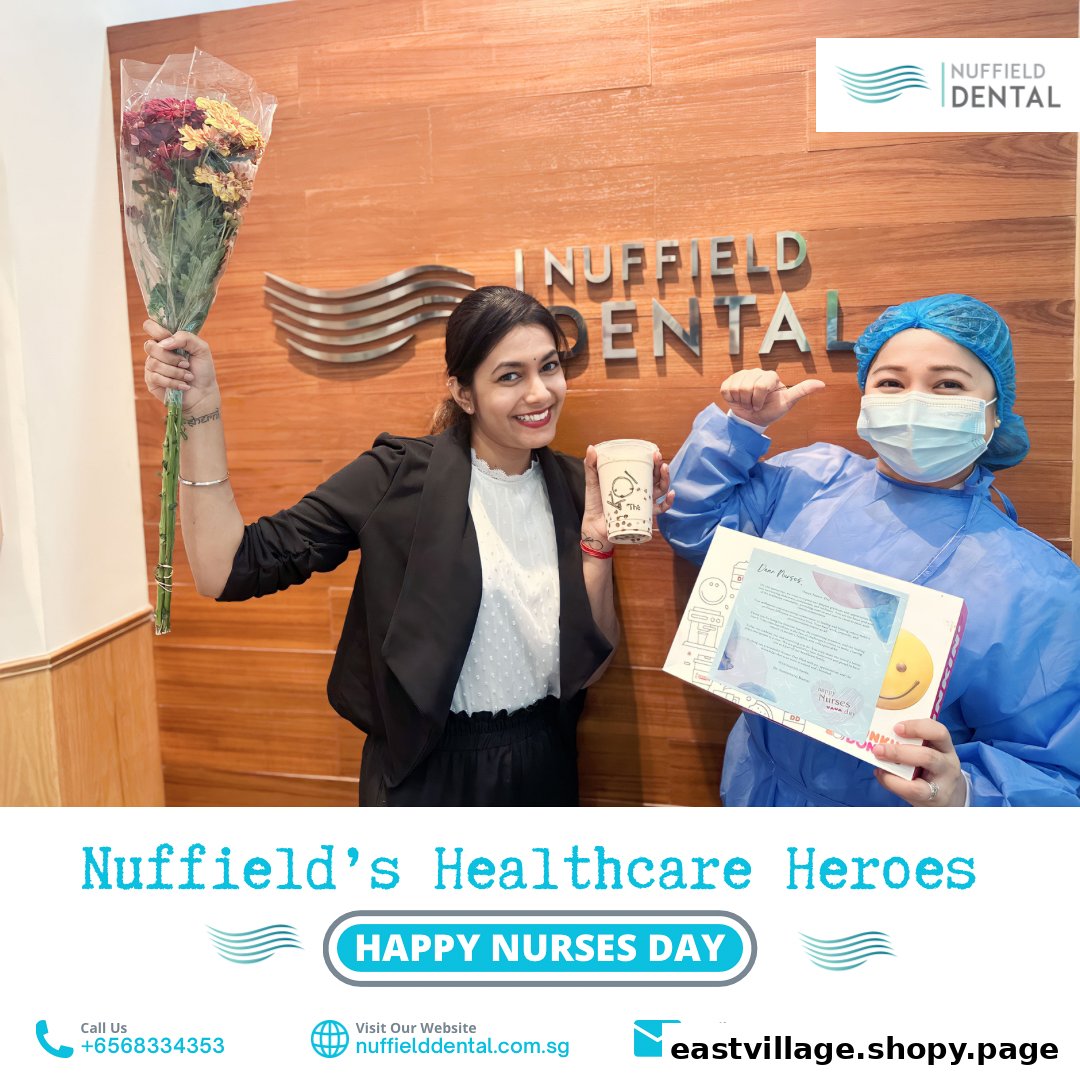 Two Nuffield Dental staff members celebrating Nurses Day with flowers and gifts.