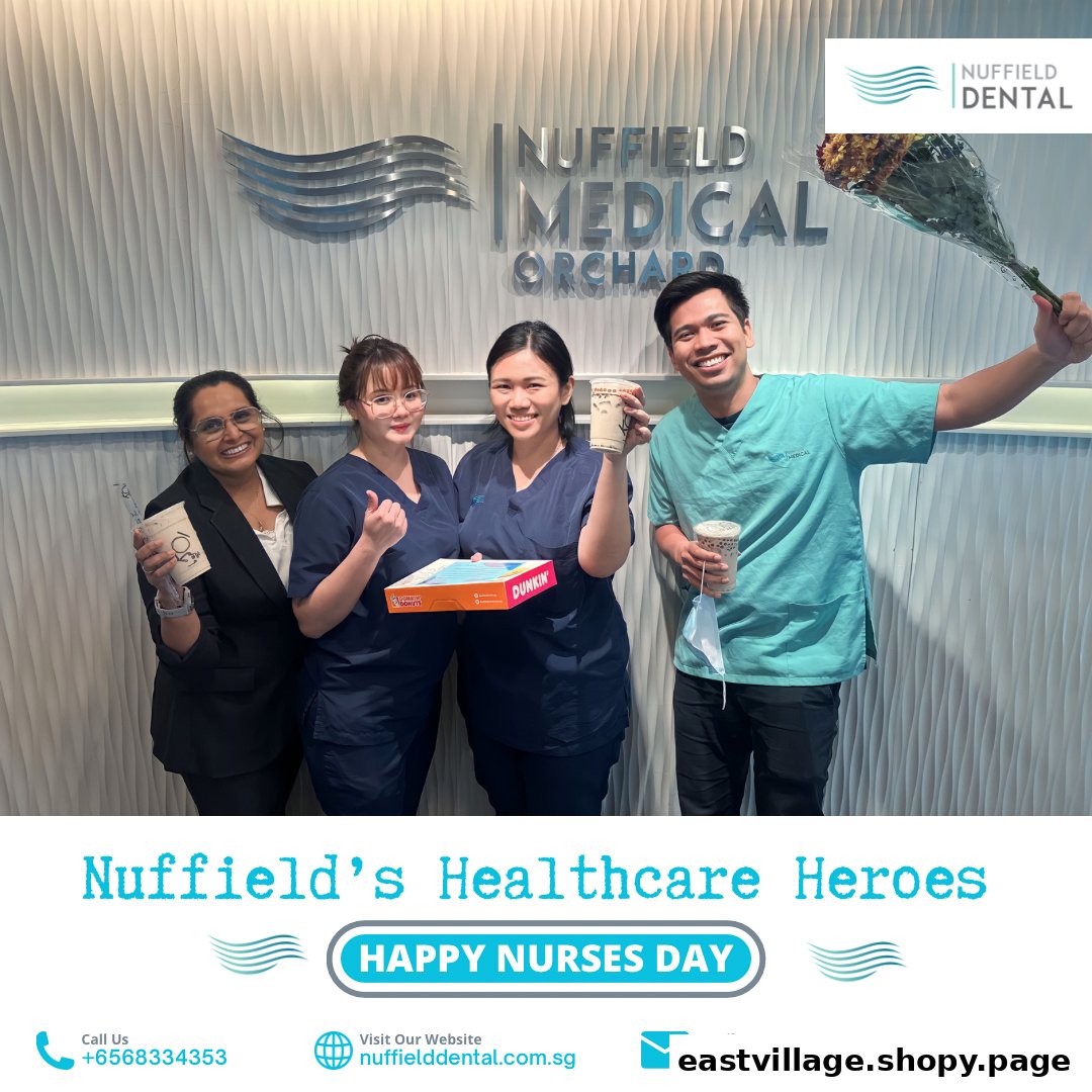 Nuffield Dental staff celebrate with gifts, showcasing a friendly and appreciative team environment.